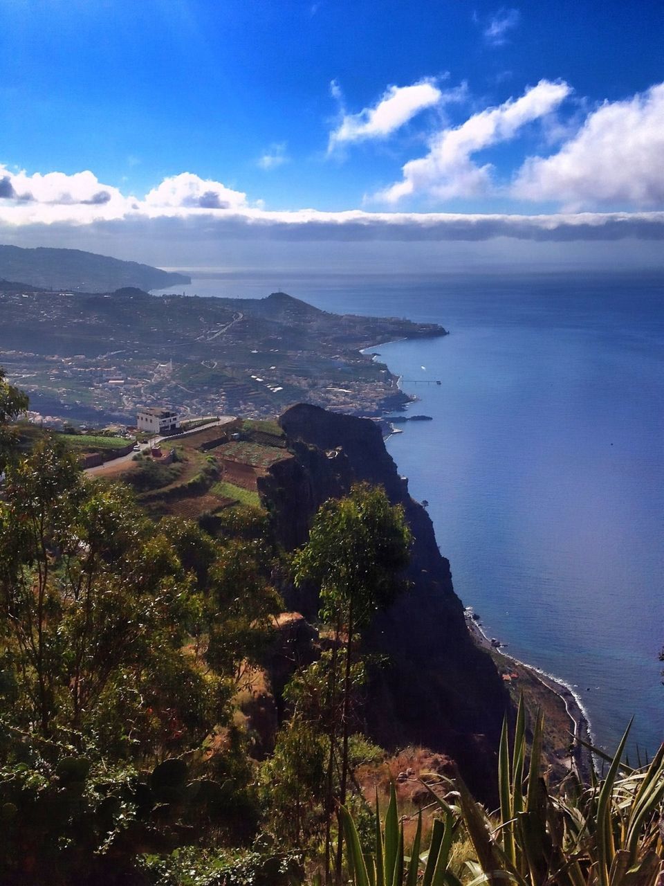 sea, water, sky, tranquil scene, scenics, tranquility, beauty in nature, nature, mountain, horizon over water, blue, high angle view, cloud, cloud - sky, idyllic, landscape, coastline, outdoors, day, no people