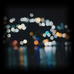 Defocused image of illuminated lights at night