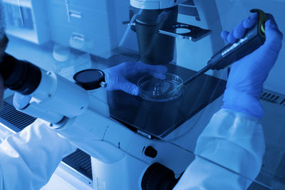 Cropped hand of scientist working in laboratory