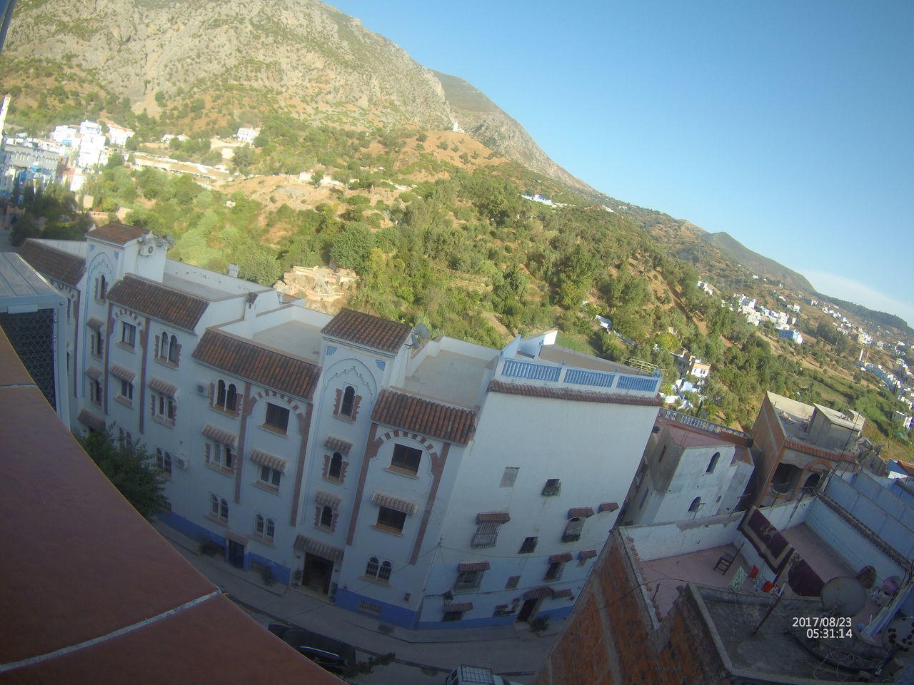 HIGH ANGLE VIEW OF RESIDENTIAL BUILDINGS AGAINST CLEAR SKY