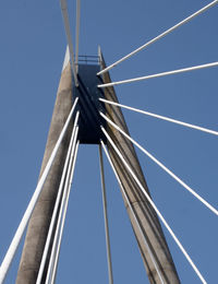 Low angle view of bridge against clear blue sky