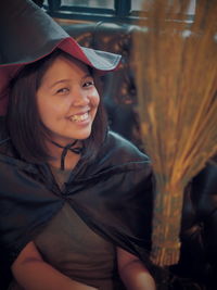 Close-up portrait of smiling young woman