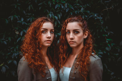 Portrait of siblings against plants