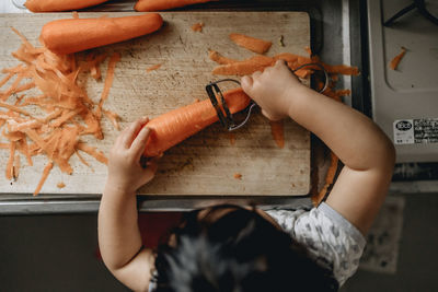 Cropped hands of woman holding food