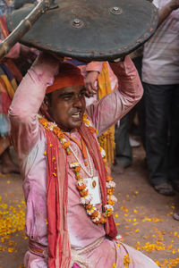 Full length of a man holding umbrella