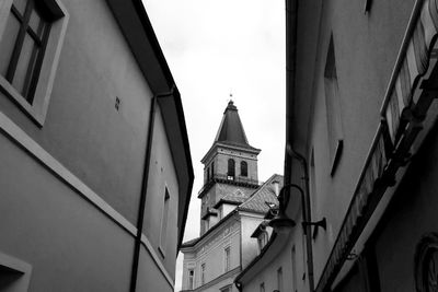 Low angle view of bell tower against sky