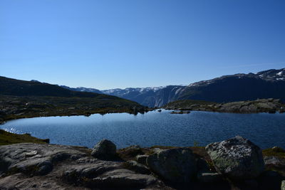 Scenic view of mountains against clear blue sky