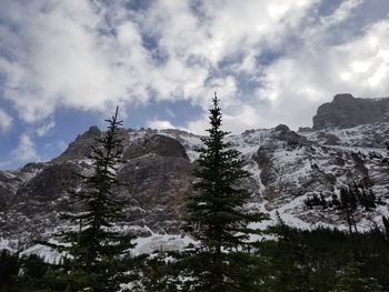Low angle view of snowcapped mountain against sky