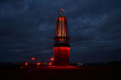 Illuminated built structure against the sky