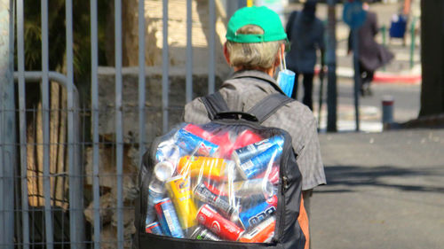 Rear view of man standing on street