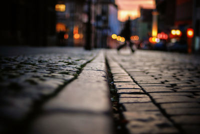 Surface level shot of cobbled street during sunset