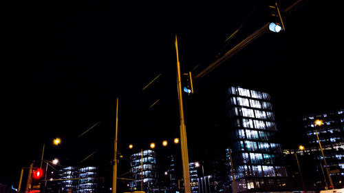 Low angle view of illuminated building at night