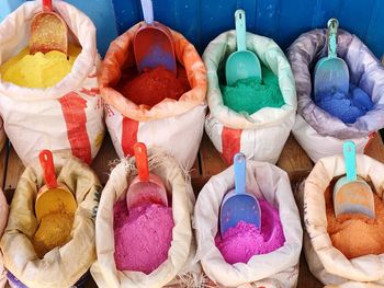 High angle view of multi colored powder paints for sale at market stall