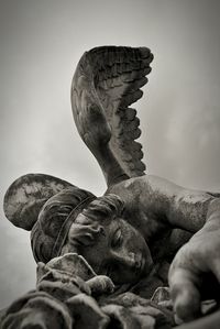 Low angle view of statue against sky