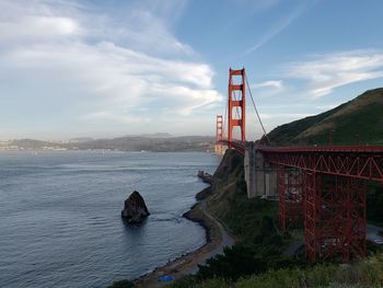 Golden gate bridge over sea against sky