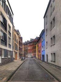 Street amidst buildings against sky