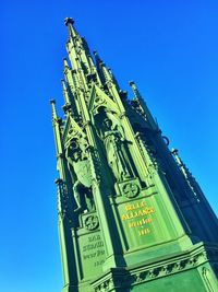 Low angle view of built structure against blue sky