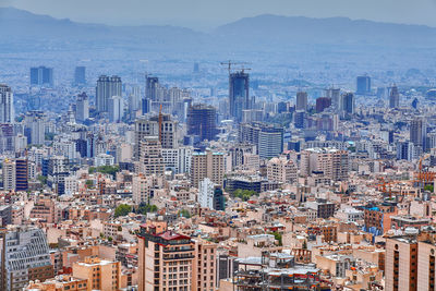 High angle view of city buildings against sky