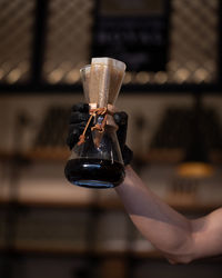 Close-up of hand holding coffee