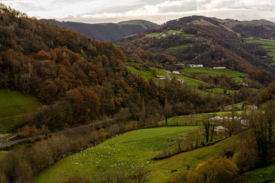 Scenic view of landscape and mountains against sky