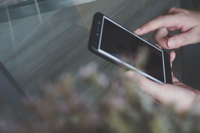 Close-up of person using mobile phone