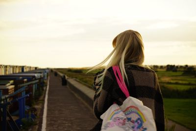 Close-up of woman standing against sky