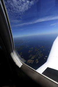 Aerial view of landscape seen through airplane window