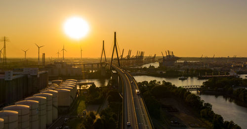 High angle view of bridge over river against sky during sunset