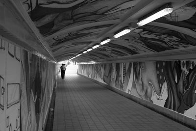 Full length of woman walking on footbridge