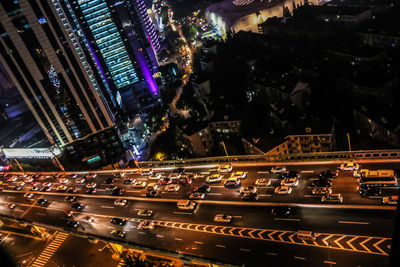 High angle view of illuminated cityscape at night