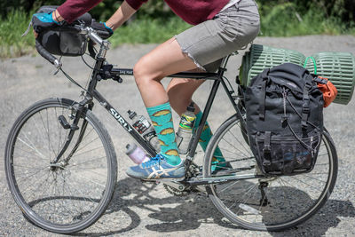 Cropped image of man riding bicycle