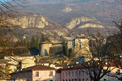 Houses in town against mountains