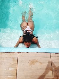 High angle view of woman swimming in pool