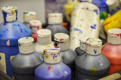 Close-up of multi colored bottles