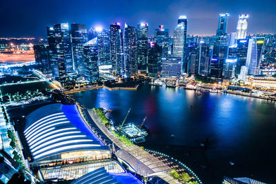 High angle view of illuminated buildings in city at night