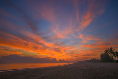 Scenic view of beach against sky during sunset