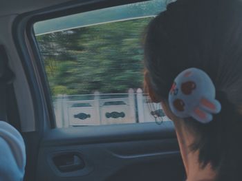 Portrait of man in car window