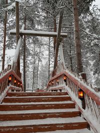 Low angle view of steps against sky during winter