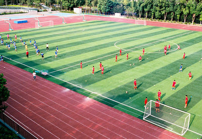 High angle view of people playing soccer field