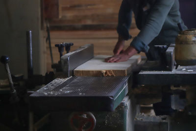 Close-up of man working in kitchen