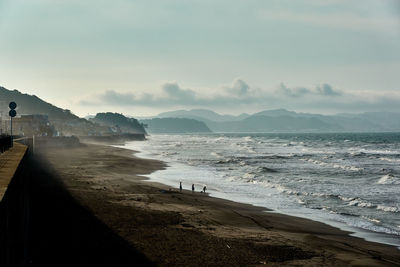 Scenic view of beach against sky