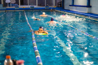 High angle view of man swimming in pool