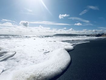 Scenic view of sea against sky during winter