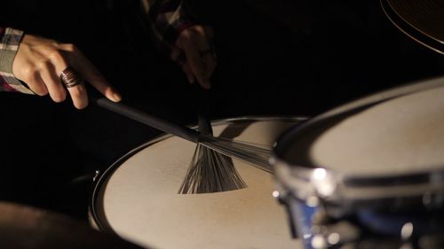 Close-up of man playing guitar