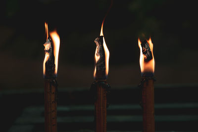 Close-up of burning candles