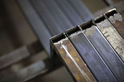 Steel parts are prepared for grinding by a grinder. metal processing in a workshop. 