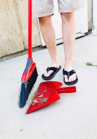 Low section of woman standing on red floor