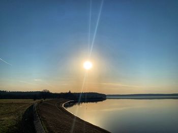 Scenic view of road against sky during sunset