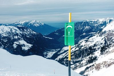 Snow covered mountains against sky