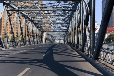 Bridge against sky in city